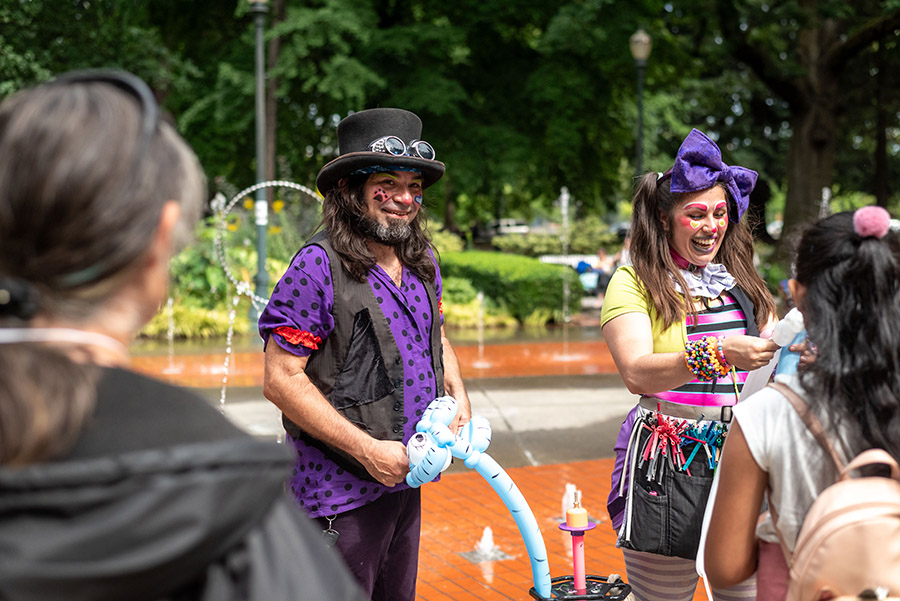 a photo of acrobatic performers at the 2023 POP party in Holladay Park.