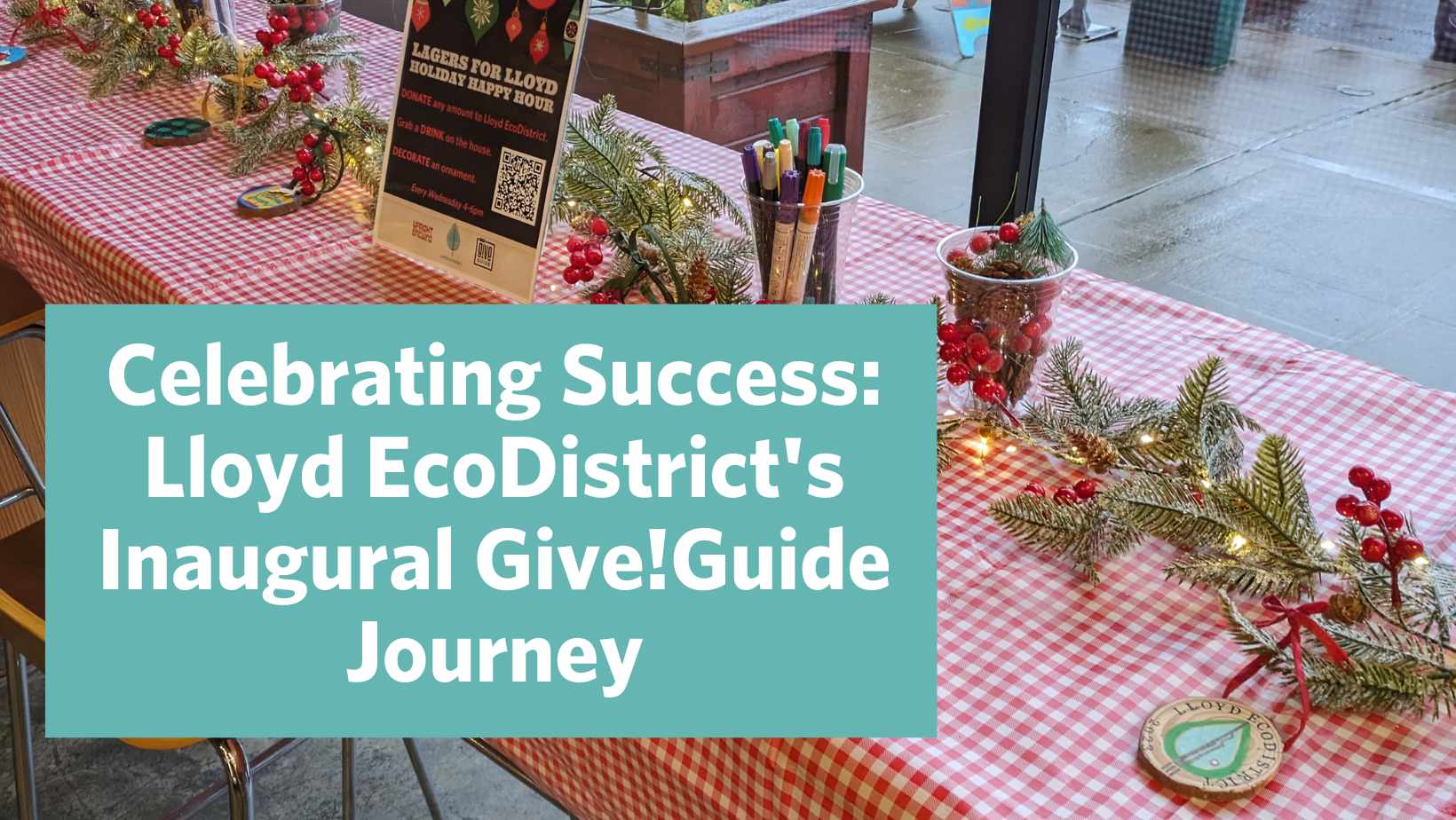an image of a table with winter holiday decor and ornaments with the words "Celebrating Success: Lloyd EcoDistrict's Inaugural Give!Guide Journey" overlaid.