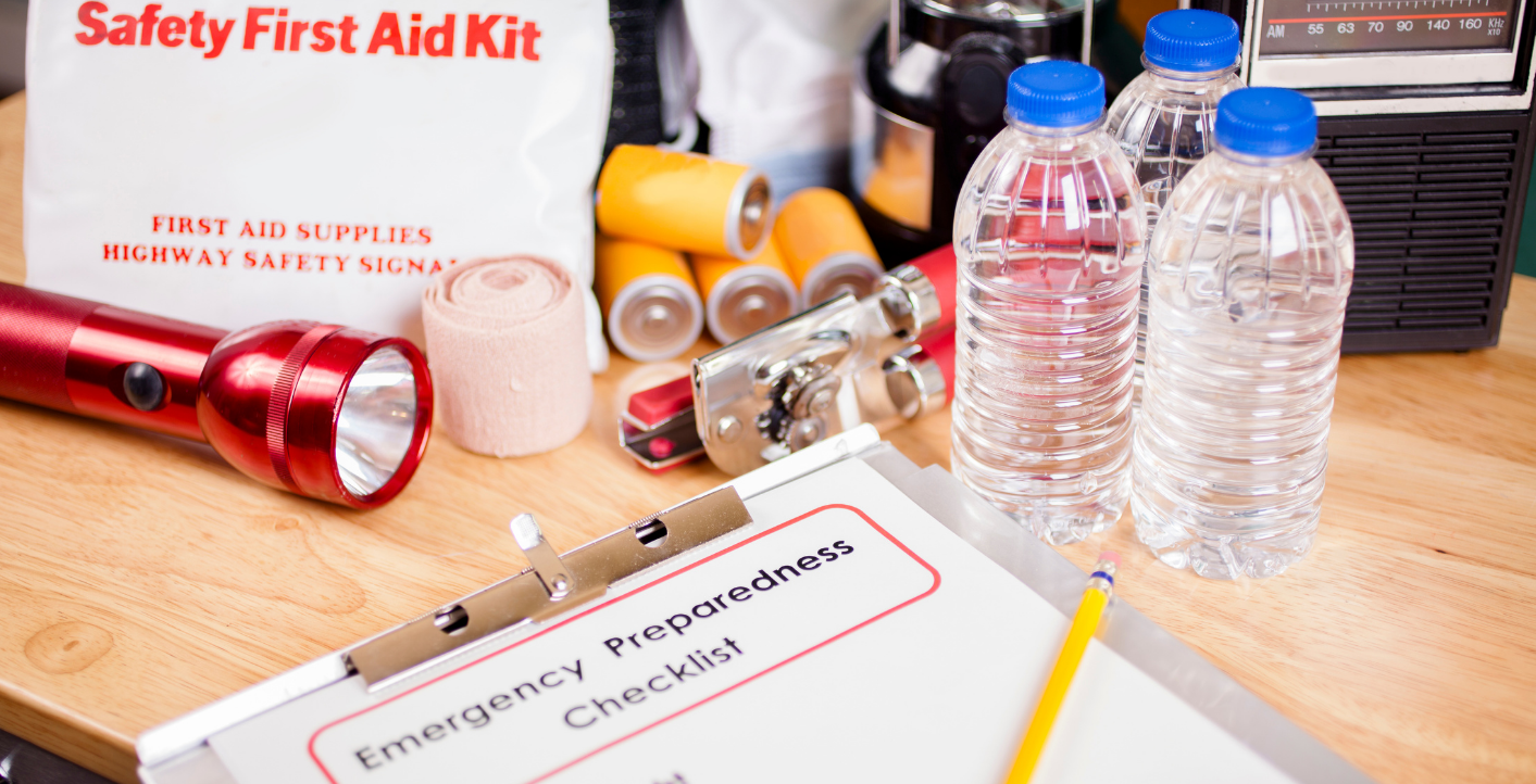a photo with a checklist showing emergency preparedness supplies on a table with supplies like water, flash light, first aid kit