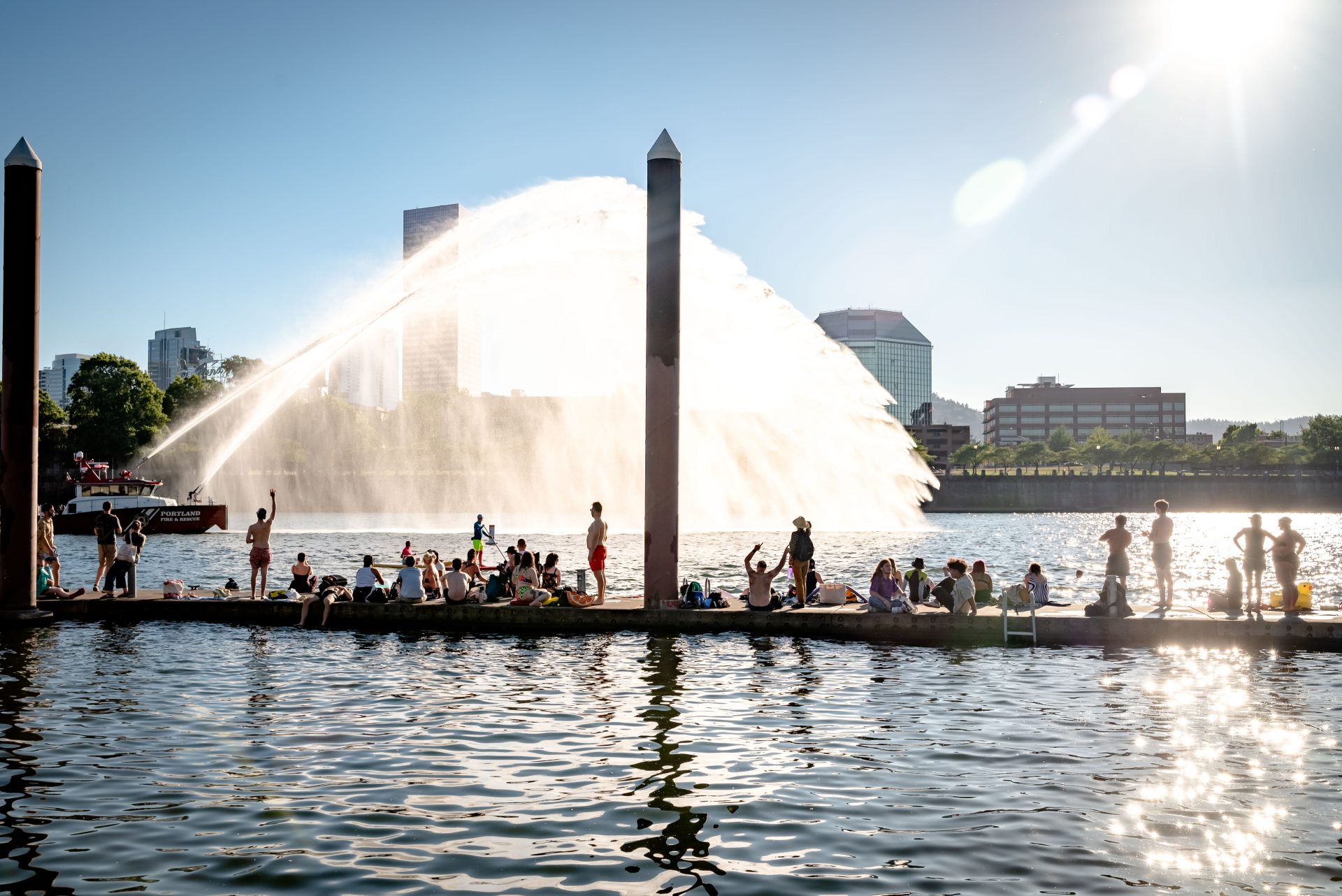 photo of a evening at Duckworth Summer Wednesdays featuring a people on the duck and fire boat spraying water