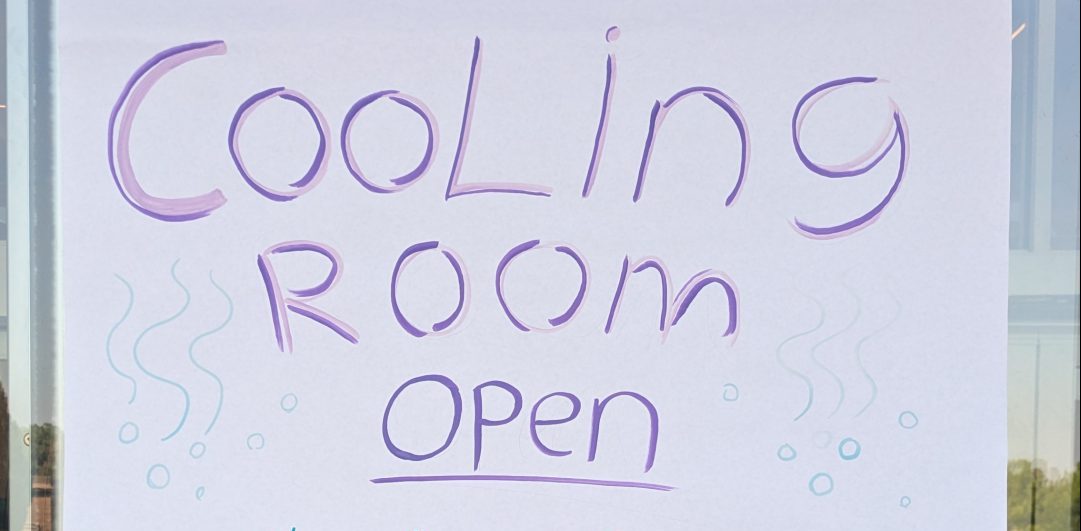 A poster saying "Cooling Room Open"