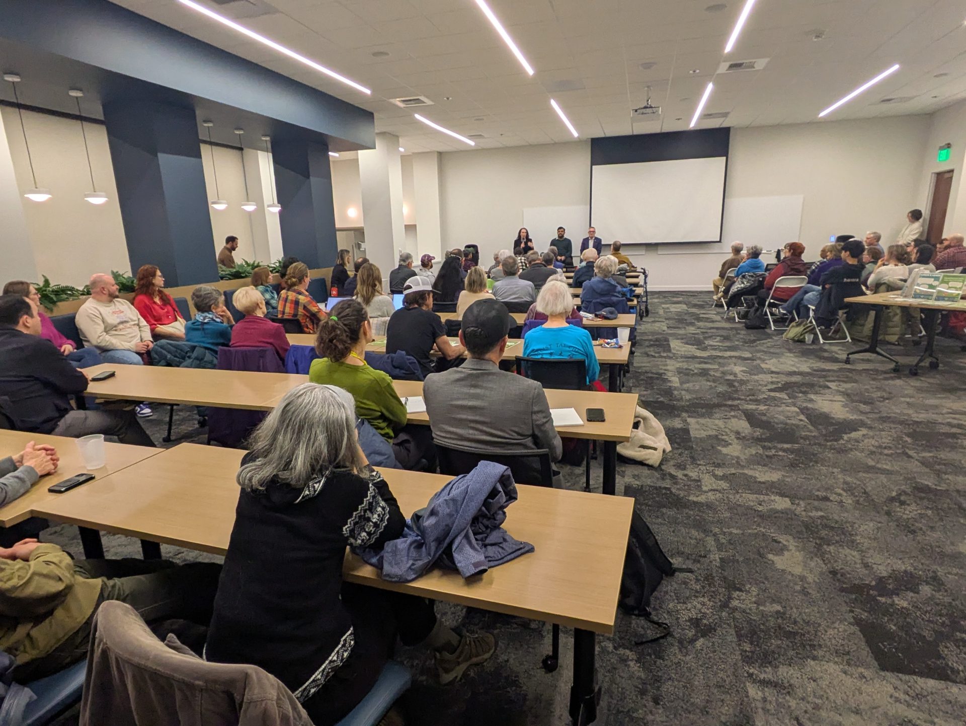 people attending a town hall conference.