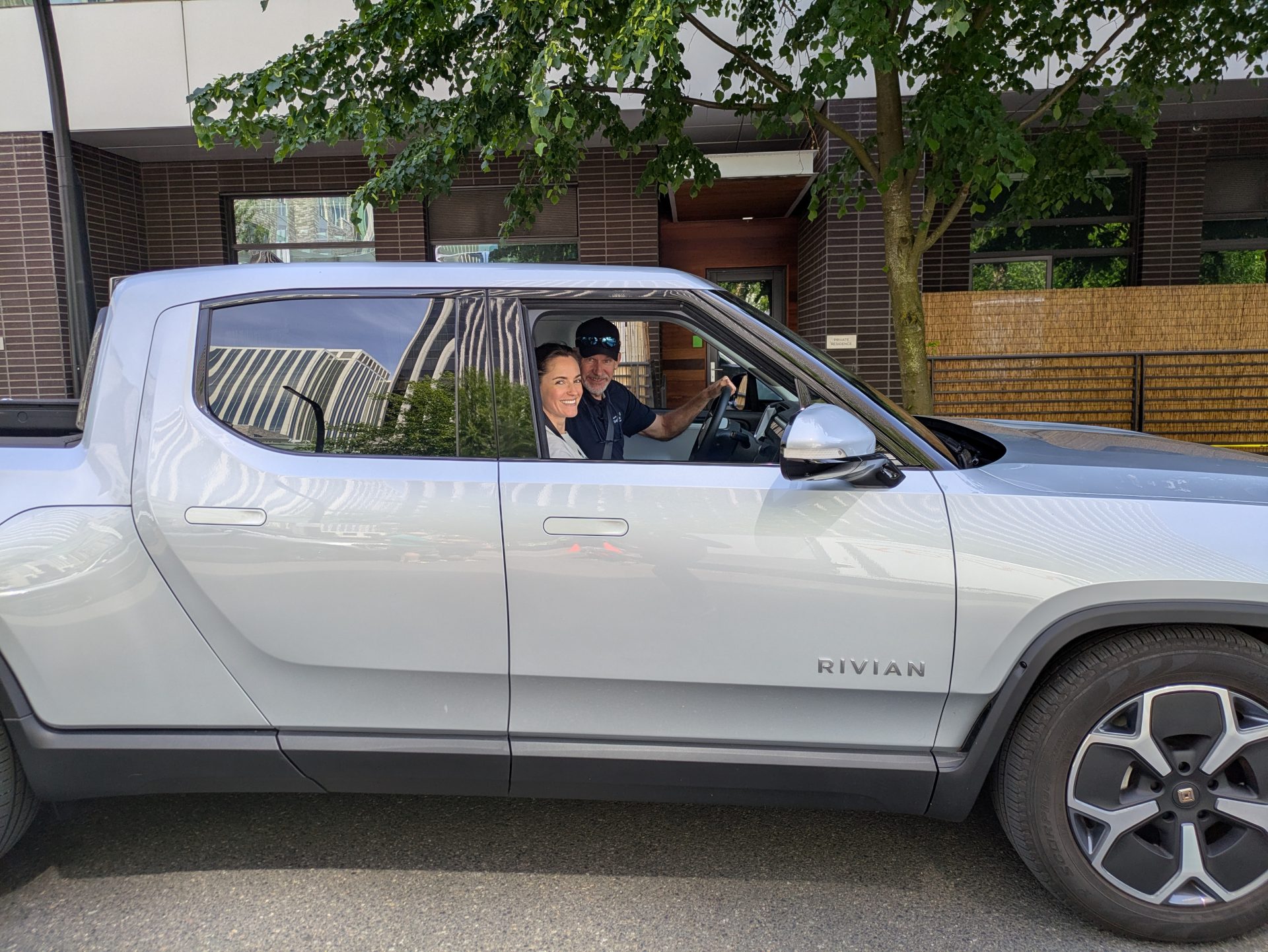 image of a some test driving a rivian