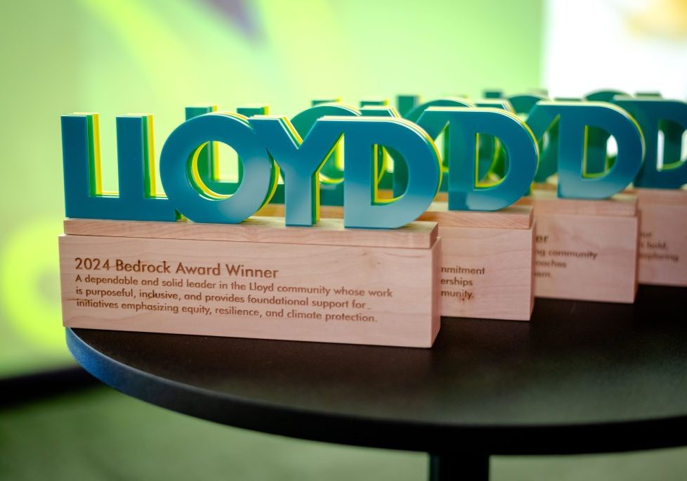 image of the Model the Way Awards on a table, with the word "Lloyd" on top of a wood block.