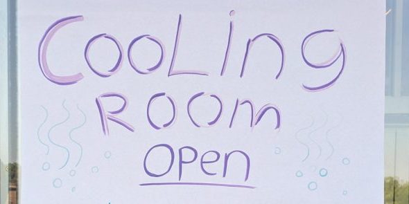 A poster saying "Cooling Room Open"