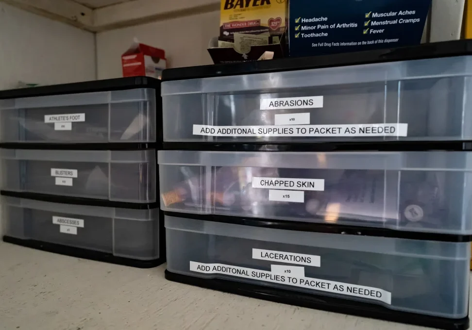 Plastic drawers labeled as containing first aid supplies