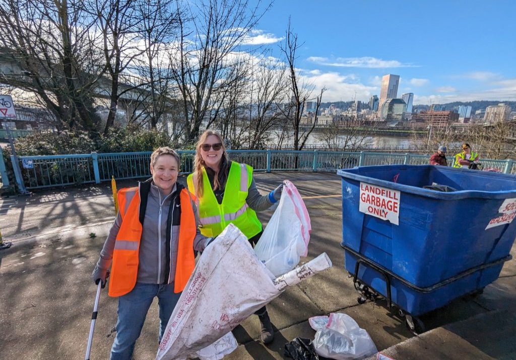 Two people posing for a photo at Peace Memorial Park, showing their cleanup progress