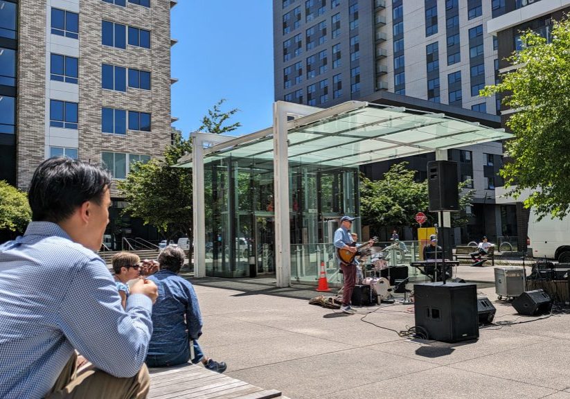 photo of the concert series with a band playing in the courtyard