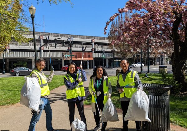 a group posing for a photo at a cleanup at Holladay Park.