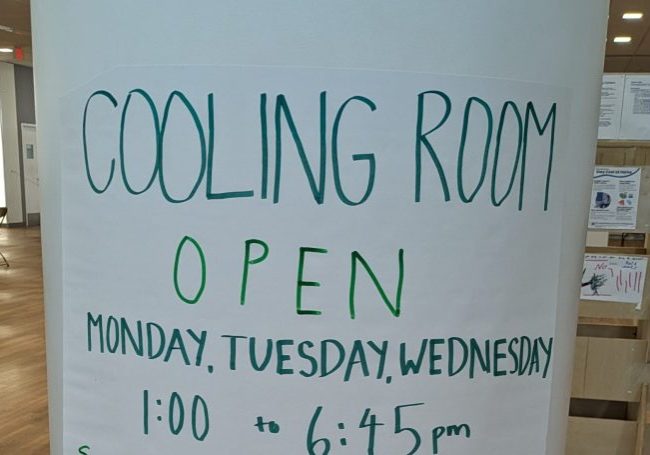 image of a poster during a heat wave saying "Cooling Room Open"