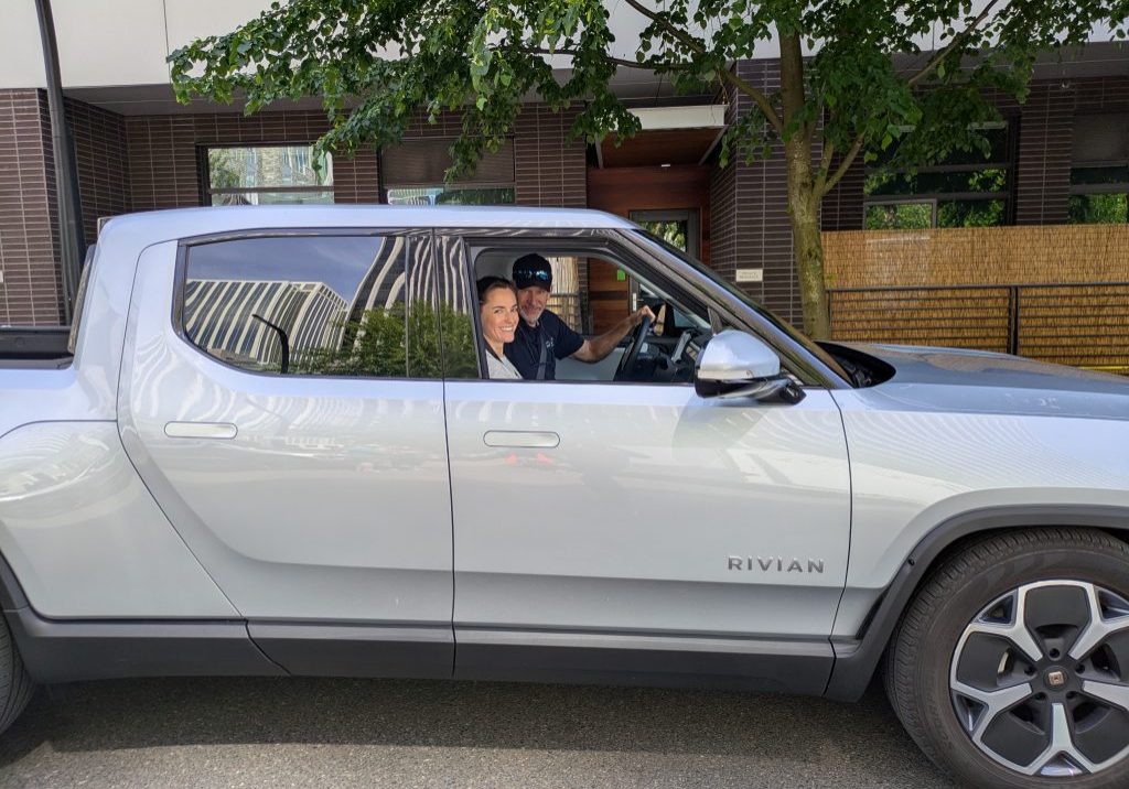 image of a some test driving a rivian